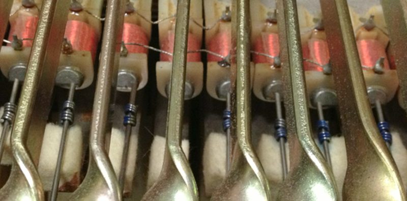 Rhodes electric piano open lid showing tine and pickup array
